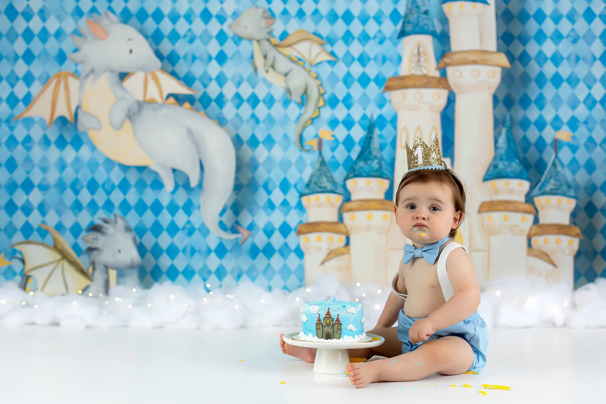 A baby sitting in front of a cake during his connecticut cake smash.