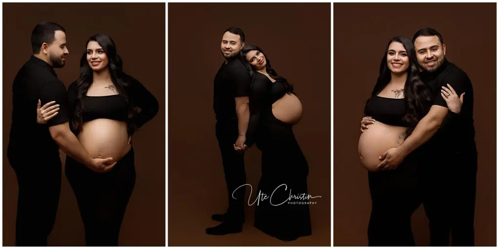 A smiling couple poses for maternity photos against a brown background. The woman wears a long black dress, showing her pregnant belly, while the man, dressed in black, gently holds her and her belly in different affectionate poses.