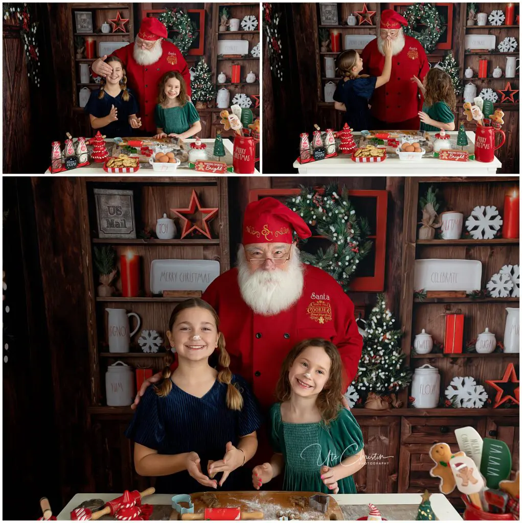 Two young girls bake cookies with Santa Claus in a festive kitchen decorated with Christmas treats, mugs, and holiday ornaments. They smile and pose together, enjoying the holiday activity.