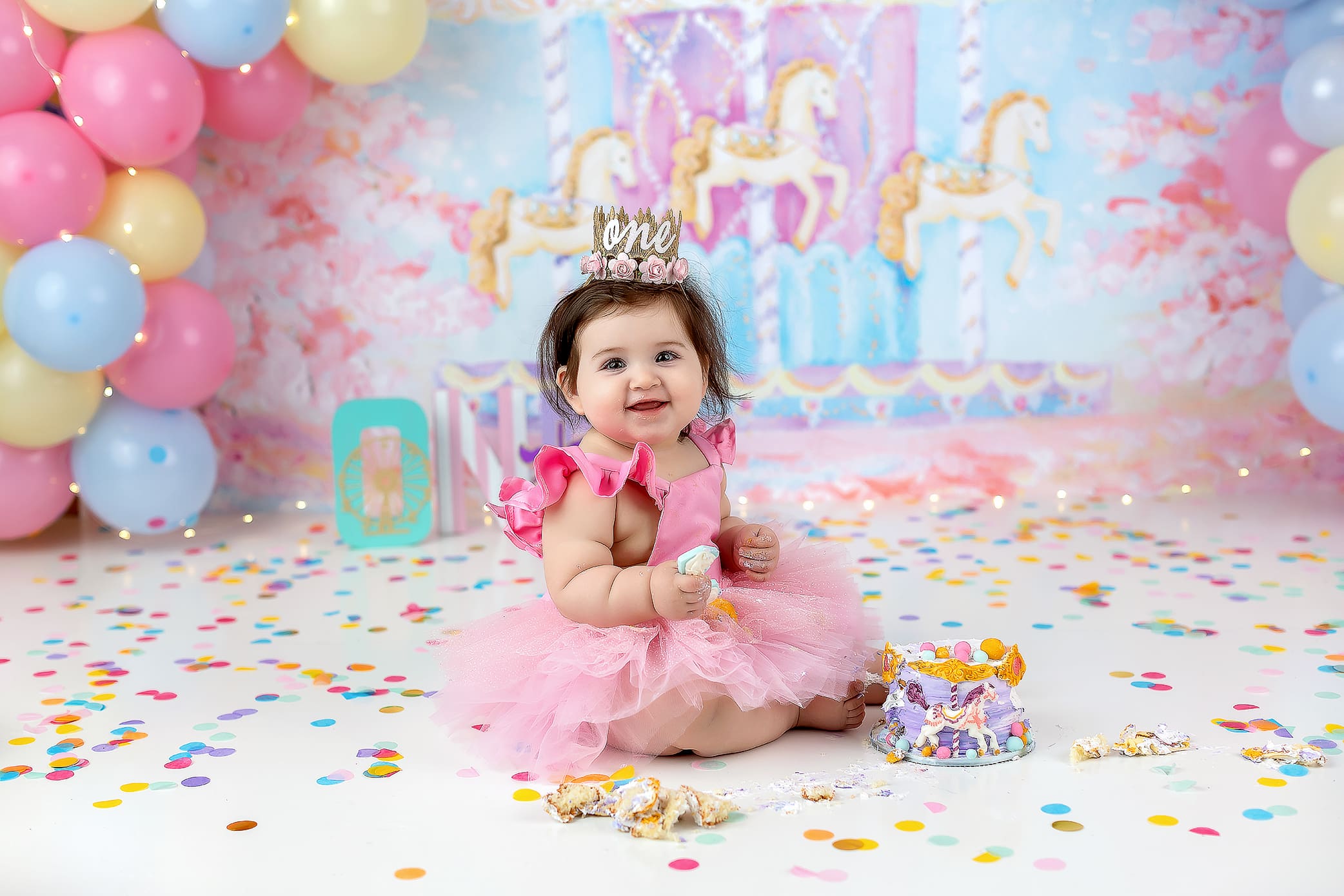 little girl in pink dress smiling