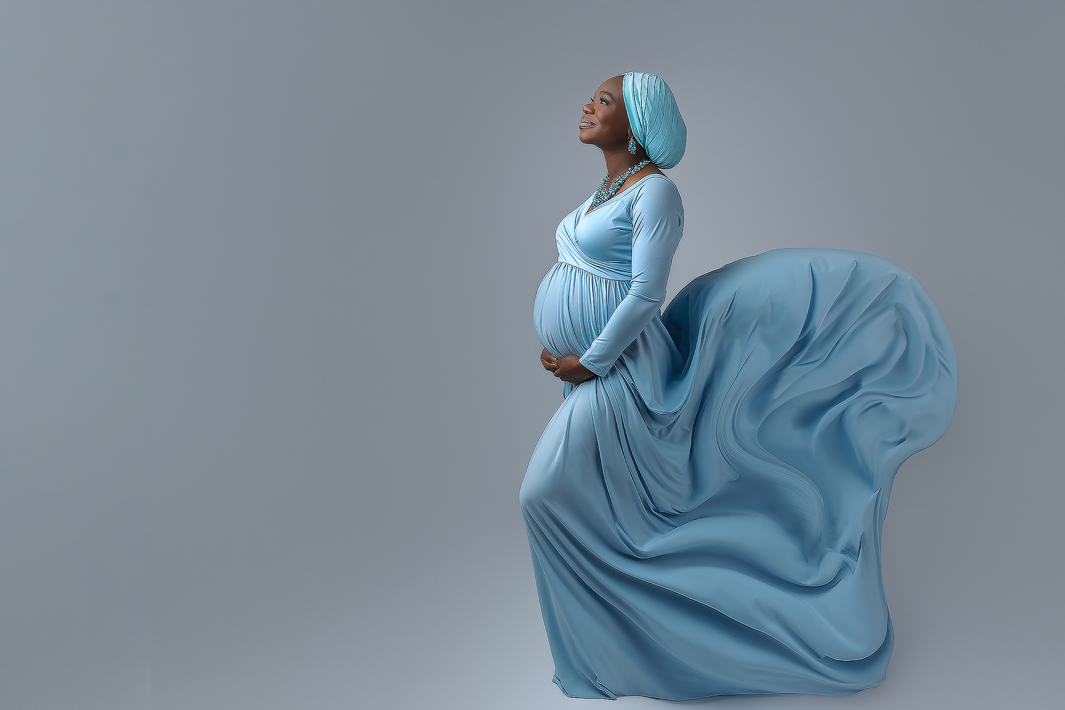 Beautiful Lady in a blue maternity gowns