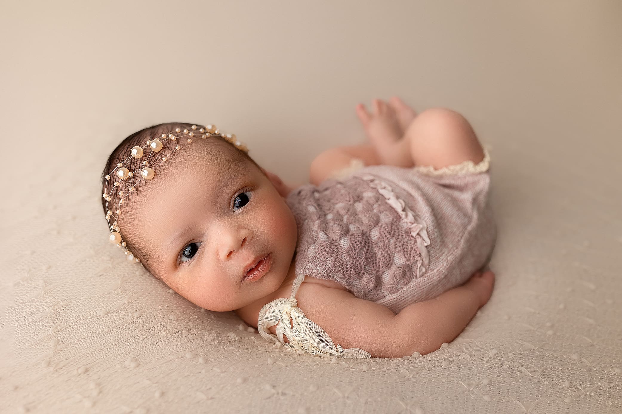 awake newborn baby during her newborn photo shoot