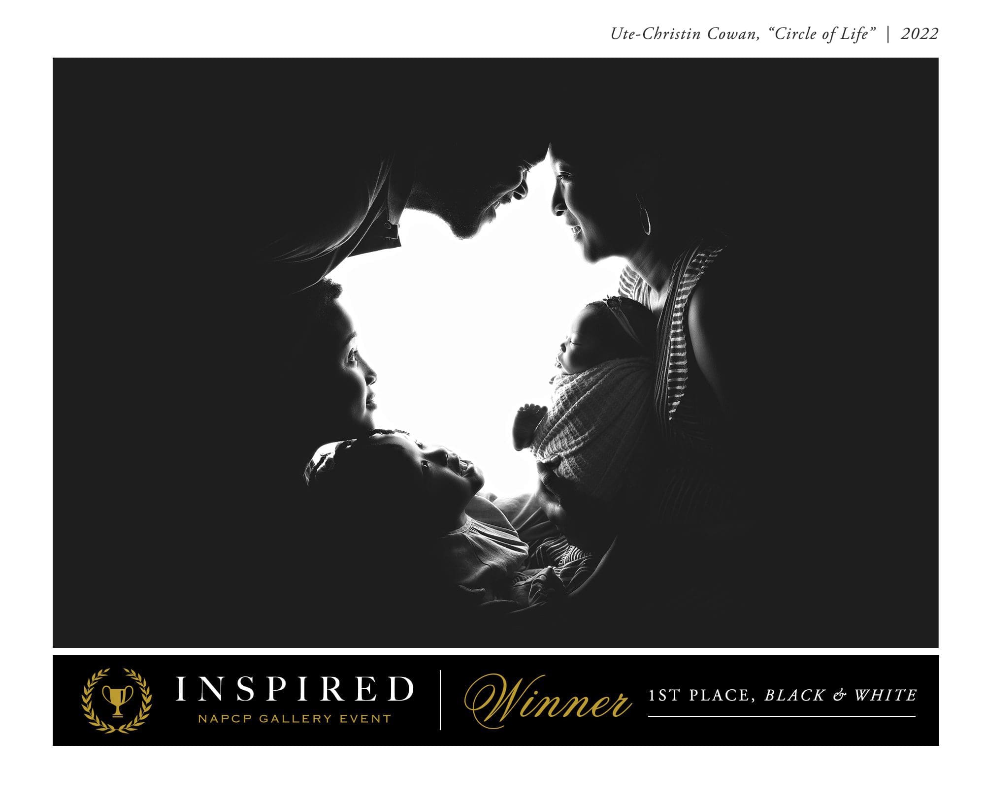 Silhouetted family portrait featuring two adults and three children facing each other, forming a circular composition. The image is in black and white and has won first place in a newborn photography competition.